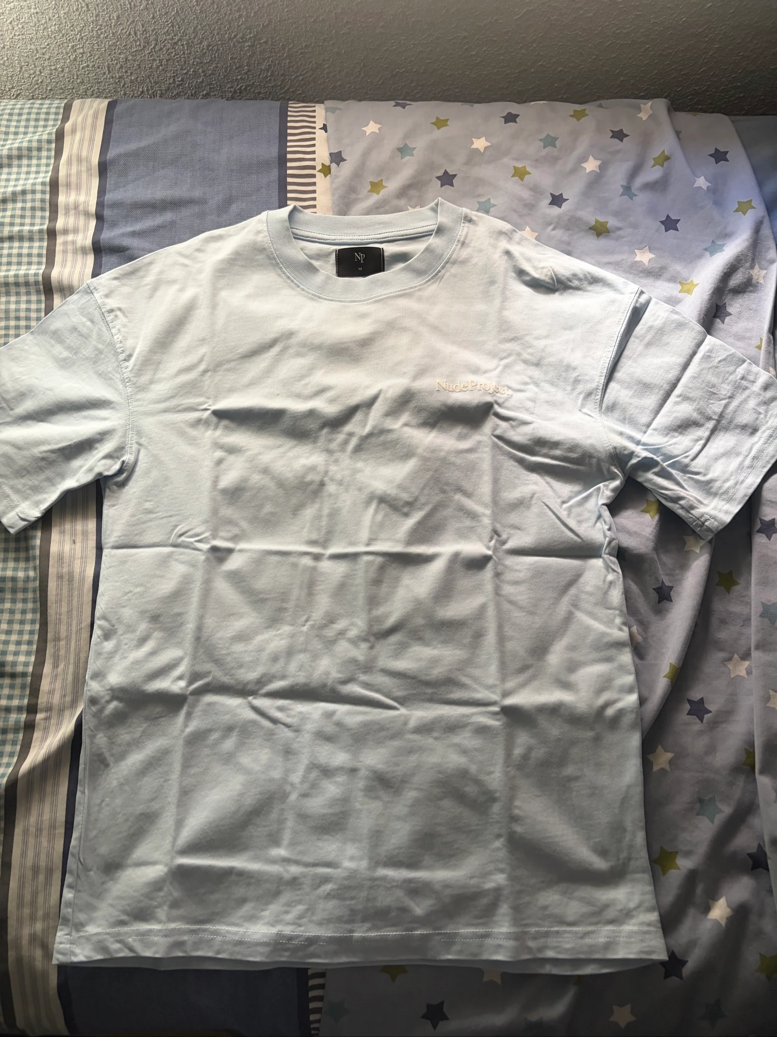Camiseta nude Project